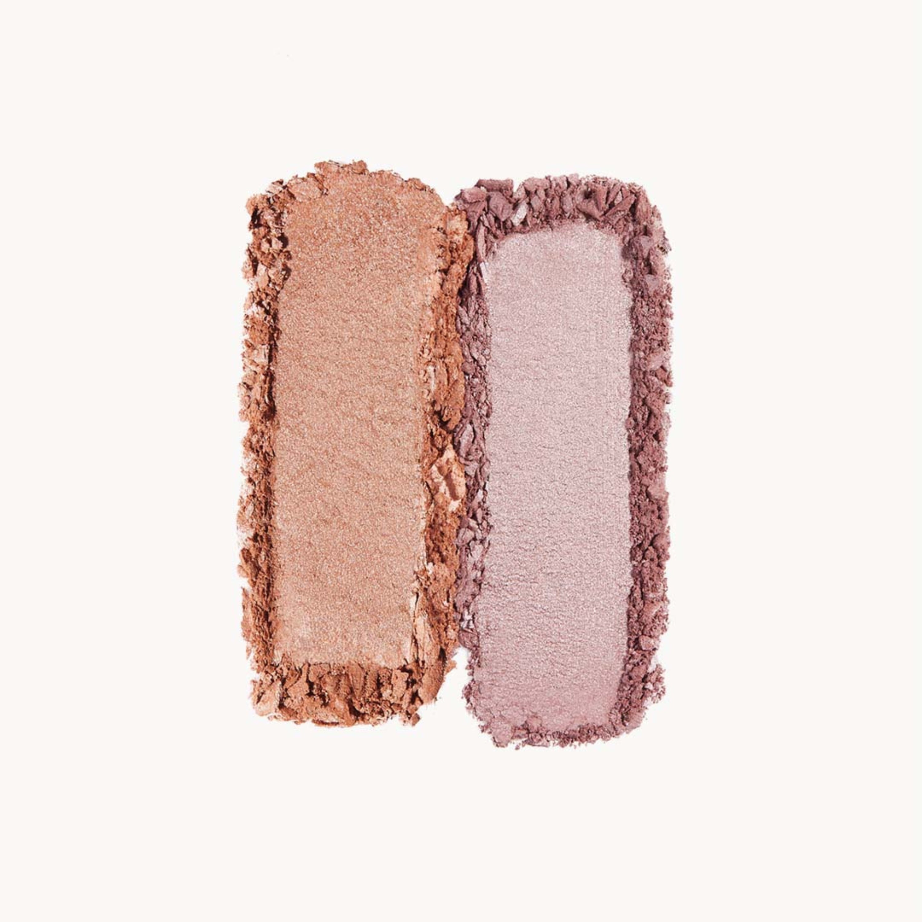 A swipe of beige eye shadow next to a swipe of lilac eye shadow on a white background