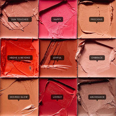 Nine different shades of cream blush. Joyful is a warm coral shade.